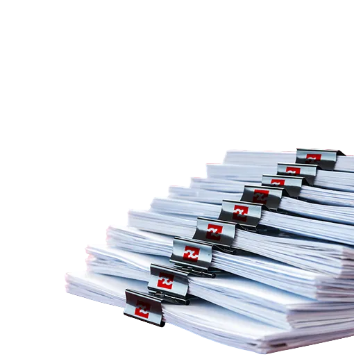 Stack of white binders with red and black clips. Technical documentation for load controls, motor power sensors, installation guides, and product datasheets.