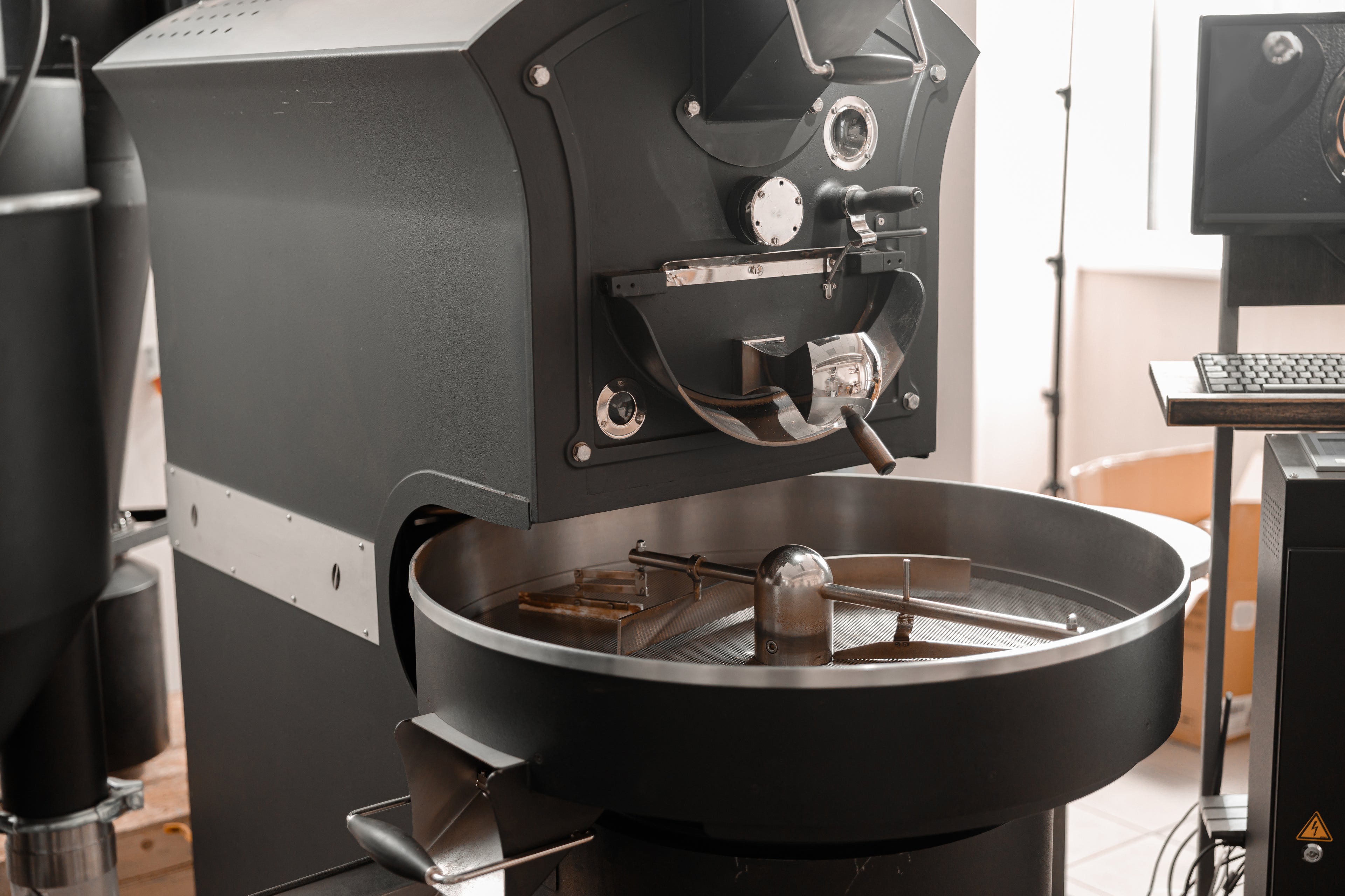 Industrial coffee roaster using Load Controls PMP-25 for drum motor load monitoring, process control, and equipment protection.