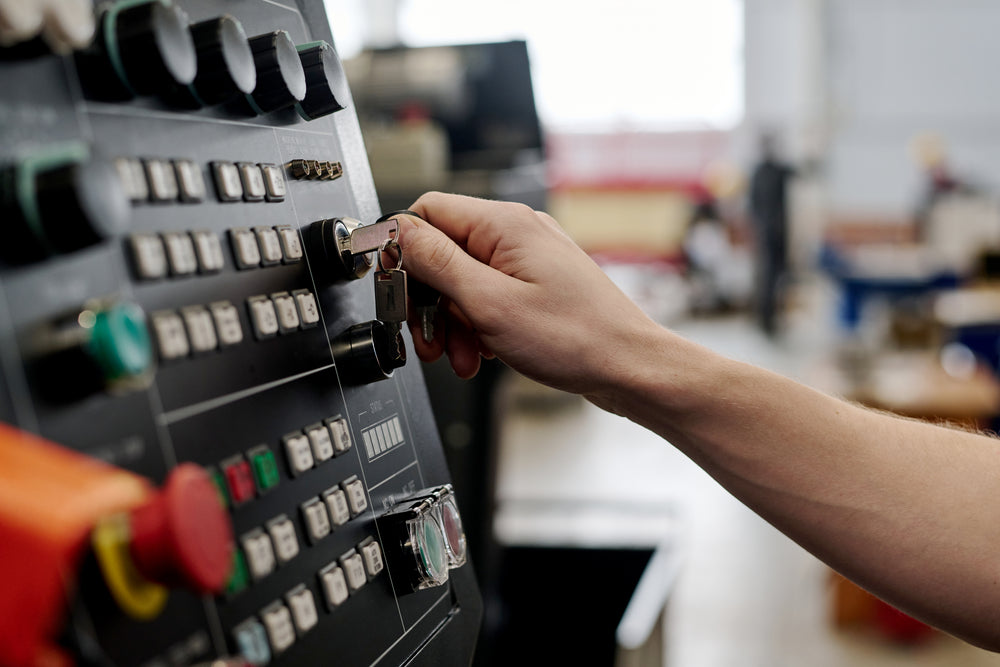 Industrial machinery control panel used to operate automated manufacturing equipment for precision machine production.